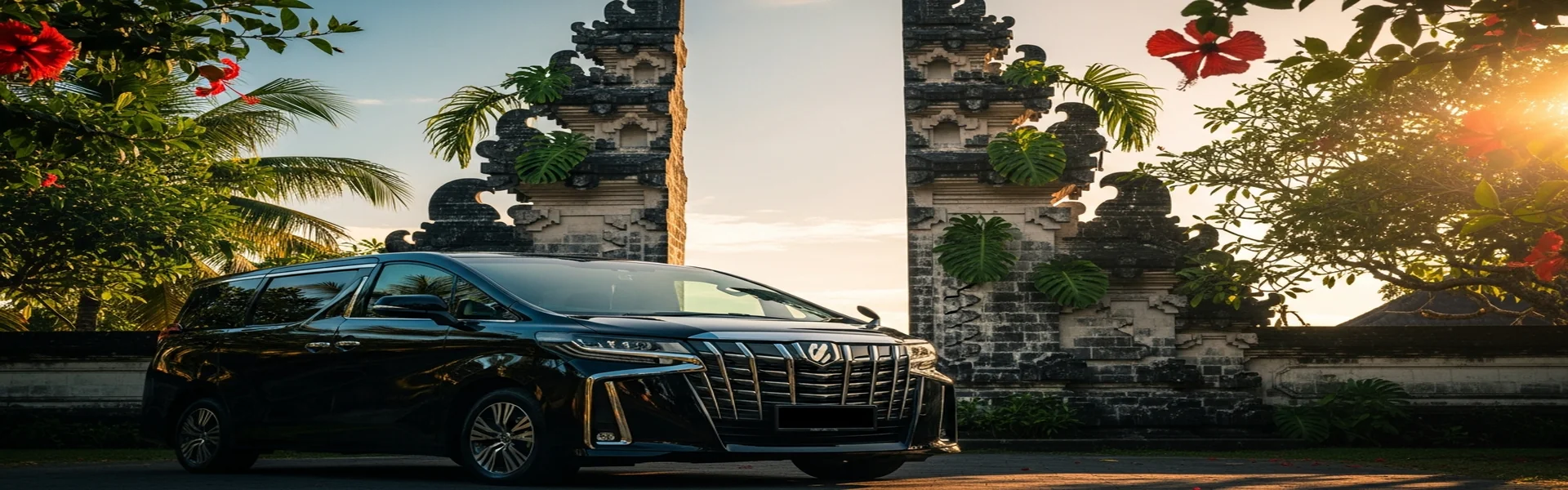 Sewa Alphard Bali - Toyota Alphard hitam di depan pura Bali
